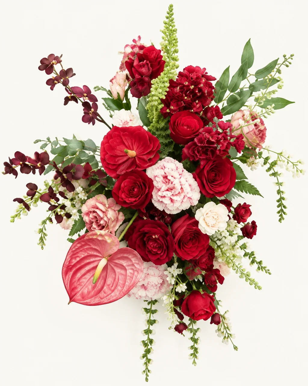 Détail des fleurs rouges, roses et blanches de la composition florale